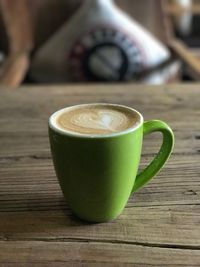 Close-up of coffee cup on table