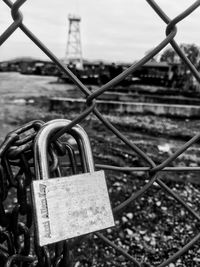 Close-up of padlocks on railing