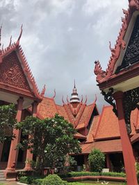 View of temple building against cloudy sky