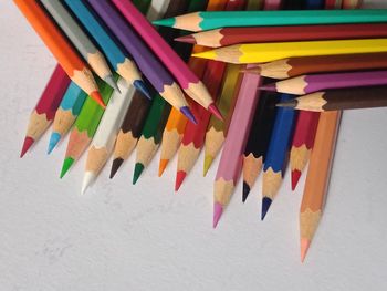 High angle view of multi colored pencils on table