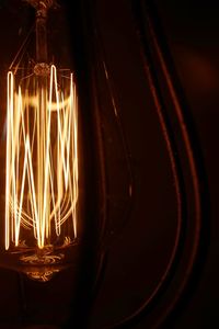 Close-up of illuminated light bulb