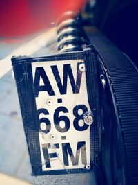 Close-up of number plate of vehicle