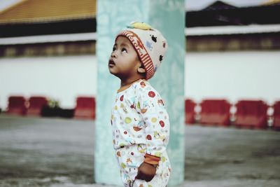 Cute baby boy looking up