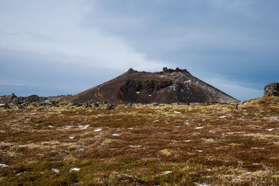 Scenic view of arid landscape against sky