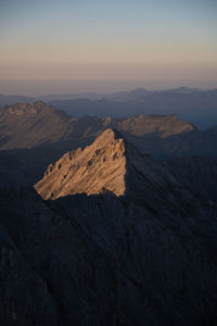 Scenic view of mountains against sky during sunset