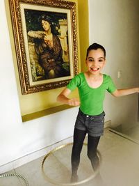 Portrait of smiling boy standing in corridor