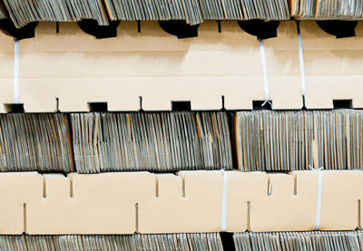 Full frame of cardboards arranged in shelves