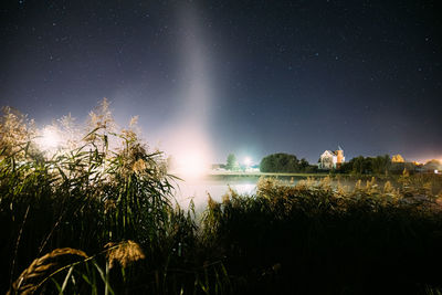 Scenic view of field against sky at night