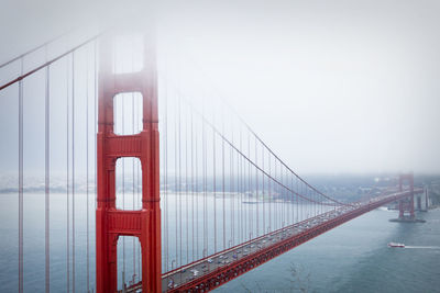 Golden gate bridge over san francisco bay against sky during foggy weather