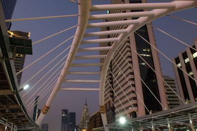 Low angle view of illuminated buildings against sky at night