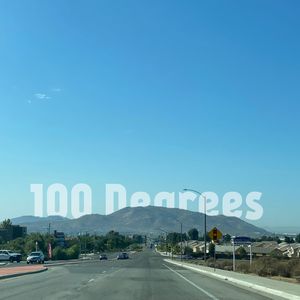 Road sign against blue sky