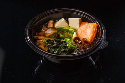 High angle view of food in bowl against black background
