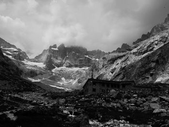 Scenic view of land and mountains against sky