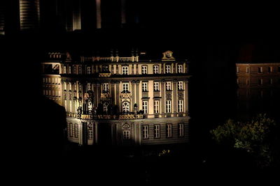 Illuminated buildings in city at night