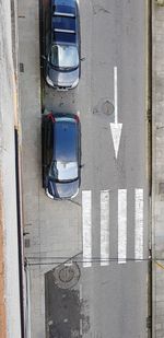 High angle view of road sign on street