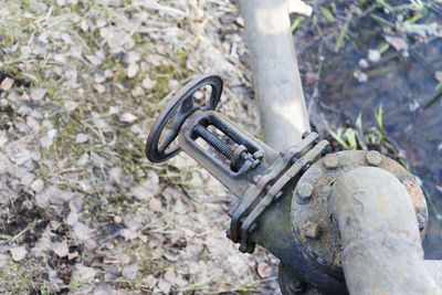 High angle view of old machine part on field