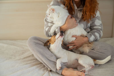 Midsection of woman with dog