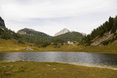 Scenic view of lake and mountains against sky