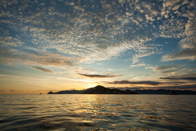 Sunset sky filled with cirrocumulus clouds above padar island