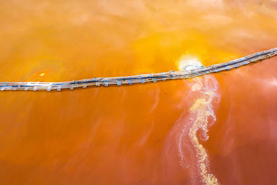 Aerial view of mining settling basin and lime supply. red polluted mine water  geamana, romania 