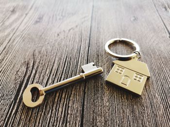 High angle view of key and ring on table