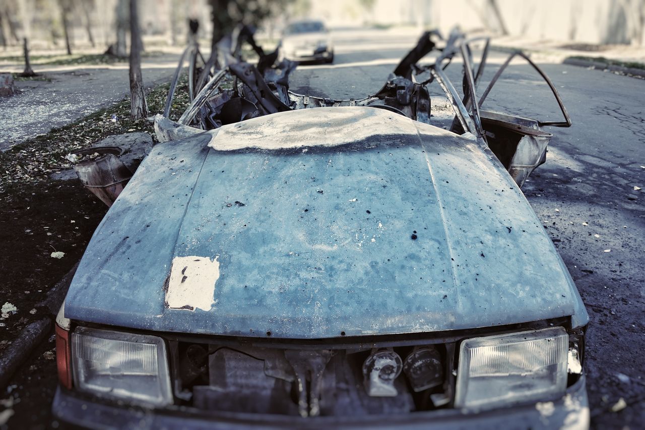 ABANDONED CAR ON LAND