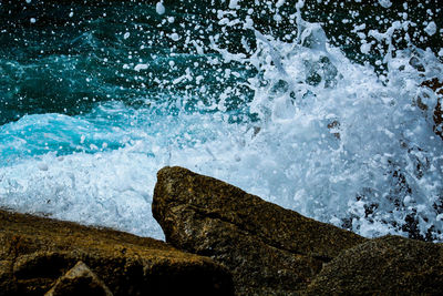 Waves breaking on rocks