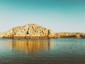 Scenic view of calm sea against clear sky