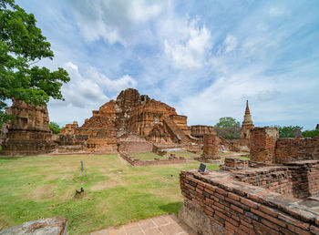 Old ruins of temple against cloudy sky