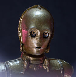 Close-up of figurine against black background