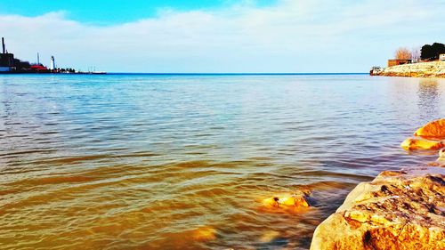 Scenic view of sea at sunset