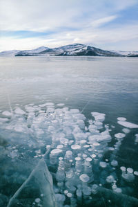 Scenic view of frozen lake against sky