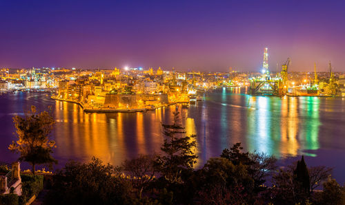 Illuminated buildings in city at night