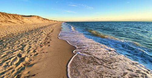 Scenic view of beach against sky at chatham, cape cod