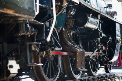 Statue on steam train