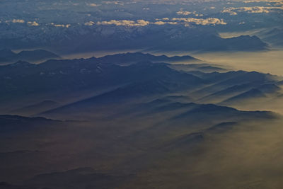 Scenic view of mountains against sky during sunset