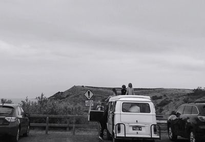 Cars on road against sky