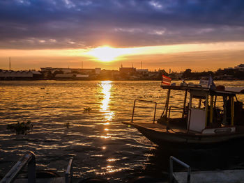 Scenic view of river against sky during sunset