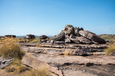 Rock formations on landscape against clear sky