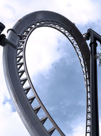 Low angle view of metallic structure against sky