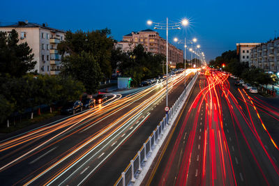 High angle view of light trails on road at night