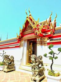 Low angle view of statue against temple