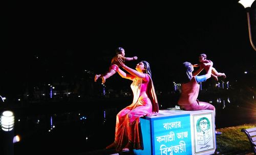 Group of people dancing at night