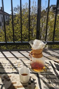 Coffee cup on table by window