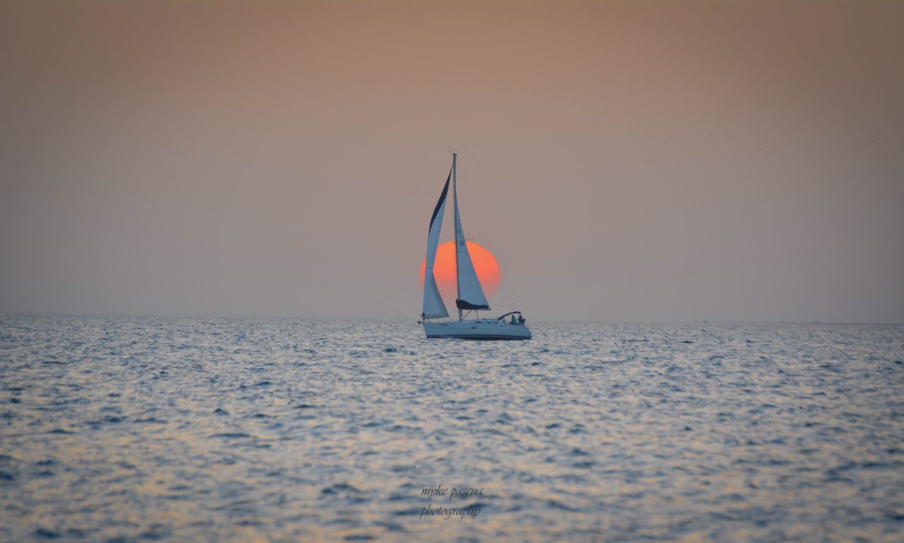 sea, water, horizon over water, nautical vessel, horizon, sky, waterfront, sailboat, scenics - nature, mode of transportation, transportation, beauty in nature, nature, sailing, tranquil scene, tranquility, travel, clear sky, copy space, outdoors, no people, yachting