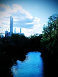 River in city against sky