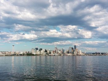 City skyline against cloudy sky