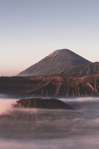 Scenic view of volcanic mountain against clear sky