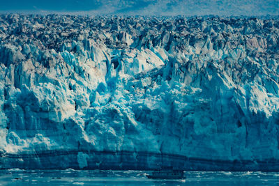 Aerial view of glacier and tour boat