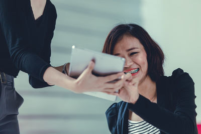 Young woman using smart phone